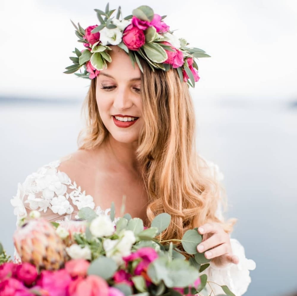 Boho bride with flower crown and bouquet in Santorini