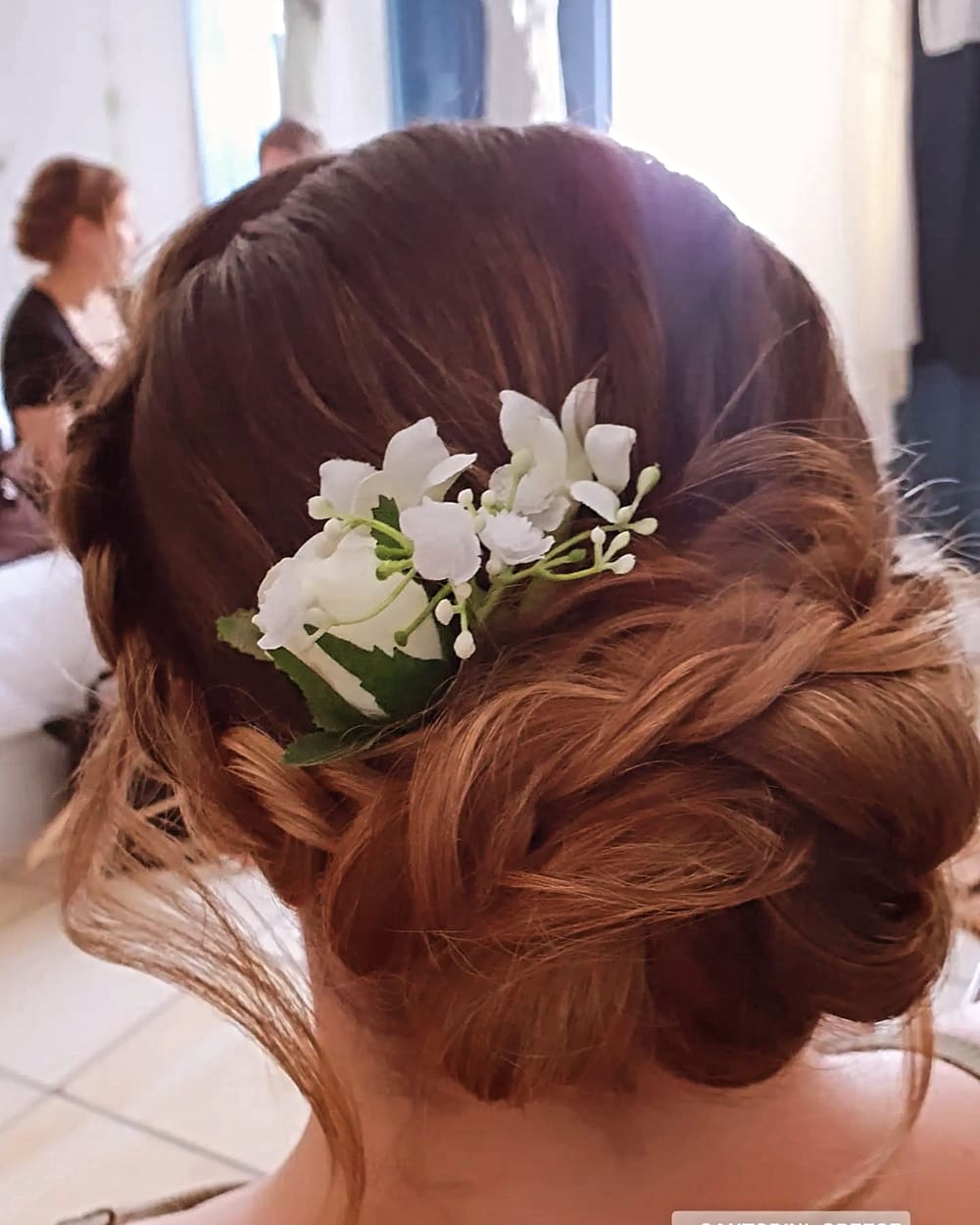 Braided updo bridal hairstyle with flowers