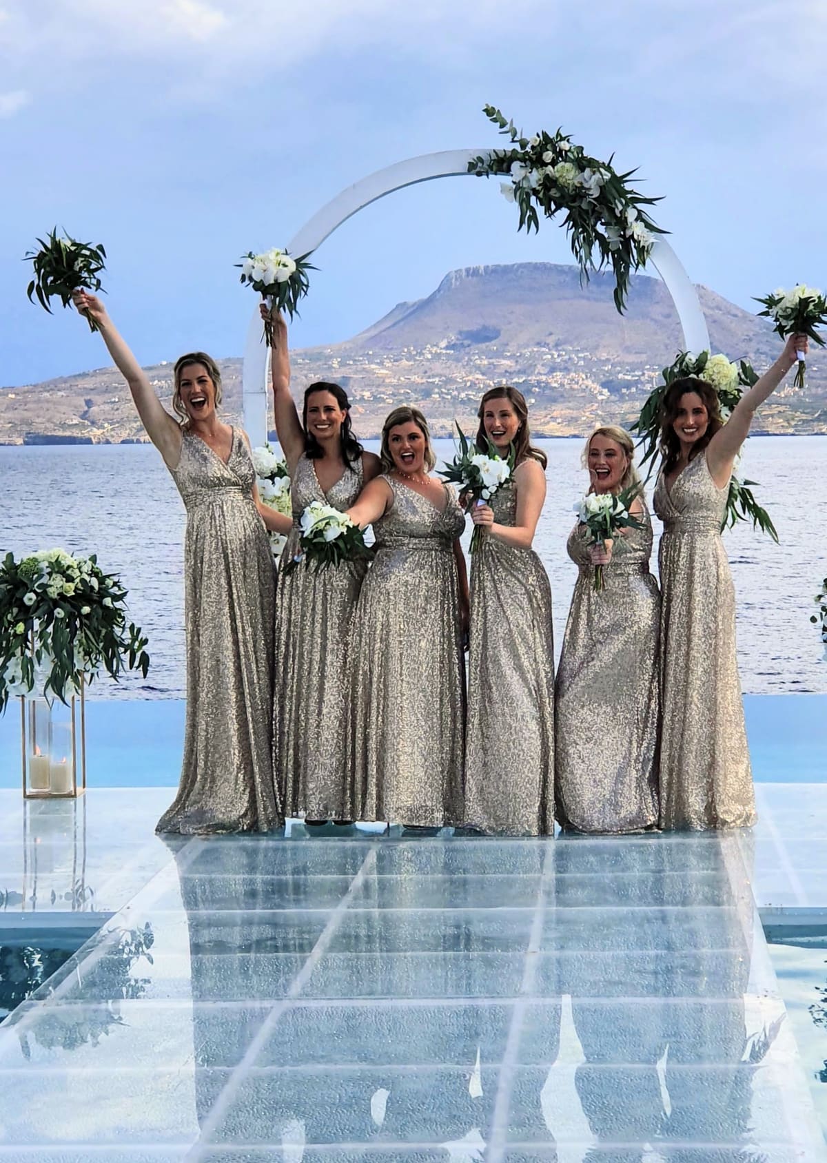 Bridesmaids in gold dresses at Crete wedding