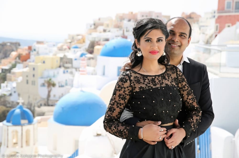 Wedding couple walking through Santorini village